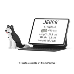 Real size of the Husky Mini 01 next to a 13-inch tablet