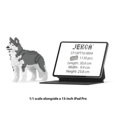 Real size of the Husky 01-M04 next to a 13-inch tablet